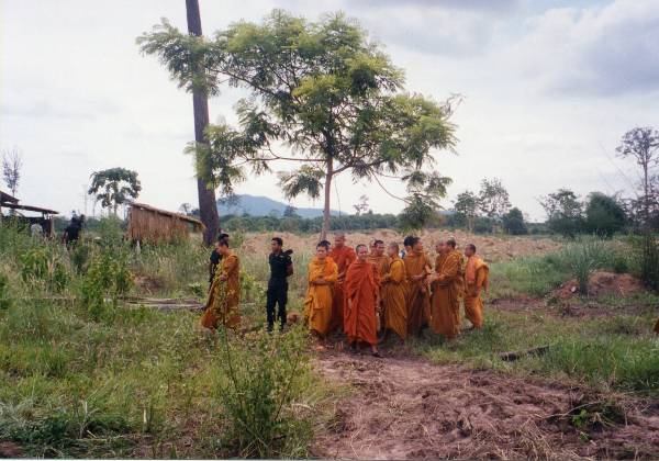 Buddhist monks sheltering under a tree